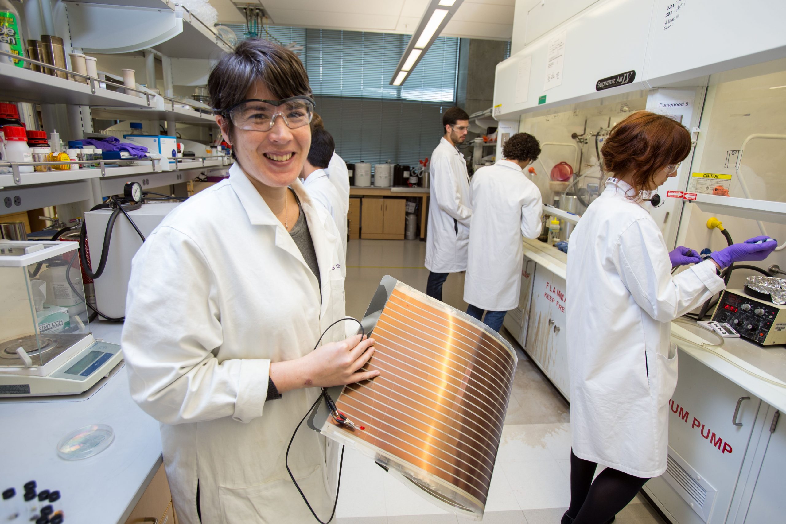 Woman holds thin energy material