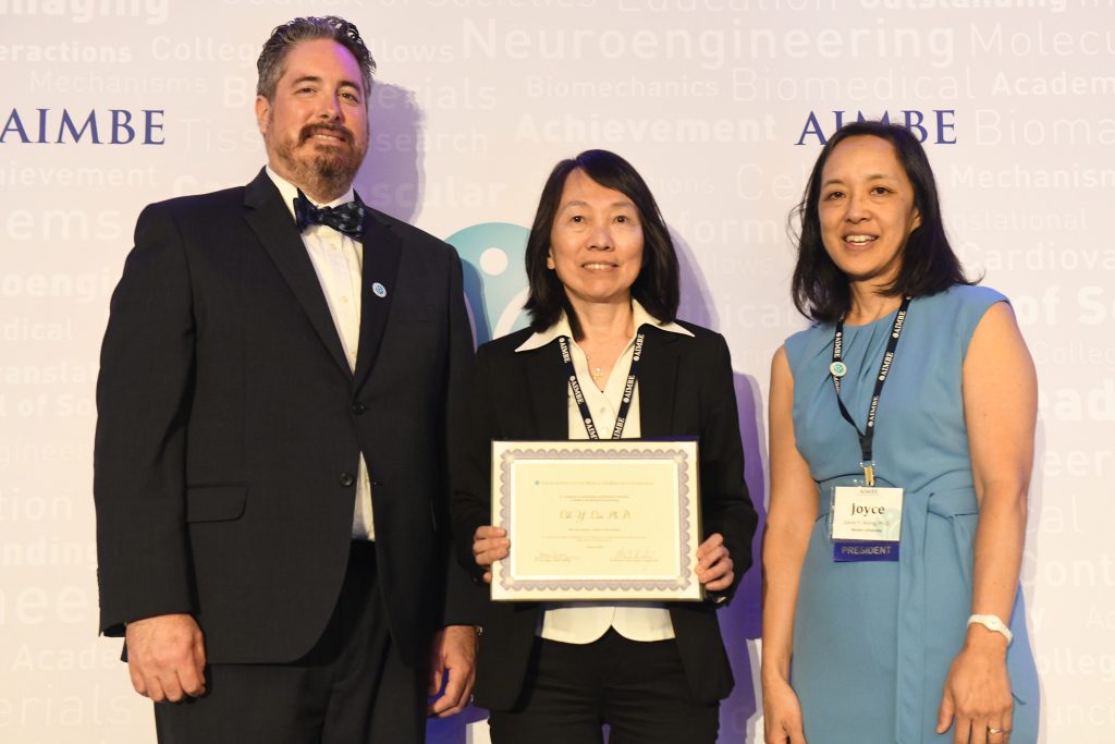 Lih Lin posting with her fellow award at the AIMBE conference.